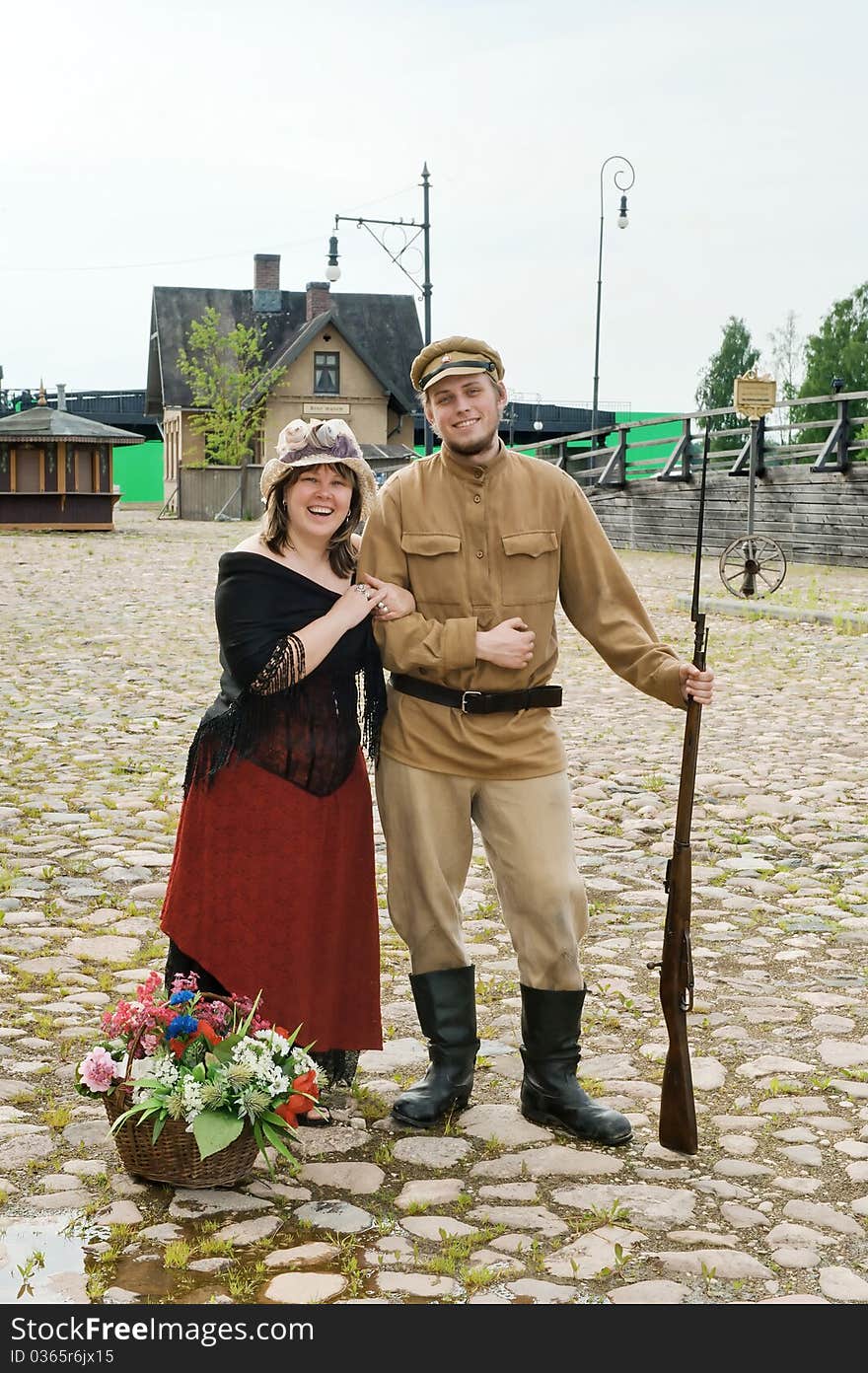 Couple of lady and soldier shown on retro-style picture. Costumes accord the times of World War I. Photo made at cinema city Cinevilla in Latvia. Couple of lady and soldier shown on retro-style picture. Costumes accord the times of World War I. Photo made at cinema city Cinevilla in Latvia.