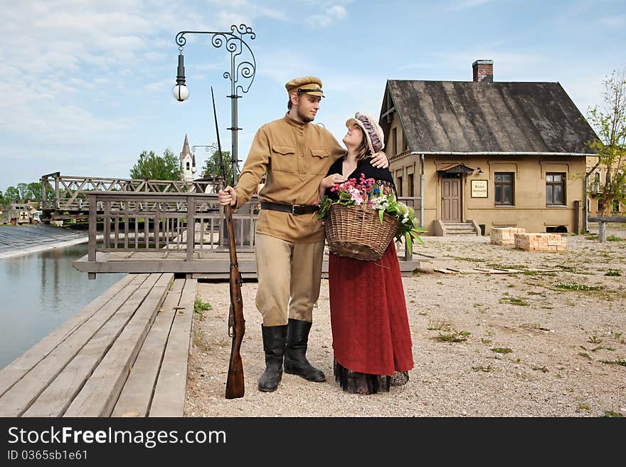 Couple of lady and soldier shown on retro-style picture. Costumes accord the times of World War I. Photo made at cinema city Cinevilla in Latvia. Couple of lady and soldier shown on retro-style picture. Costumes accord the times of World War I. Photo made at cinema city Cinevilla in Latvia.