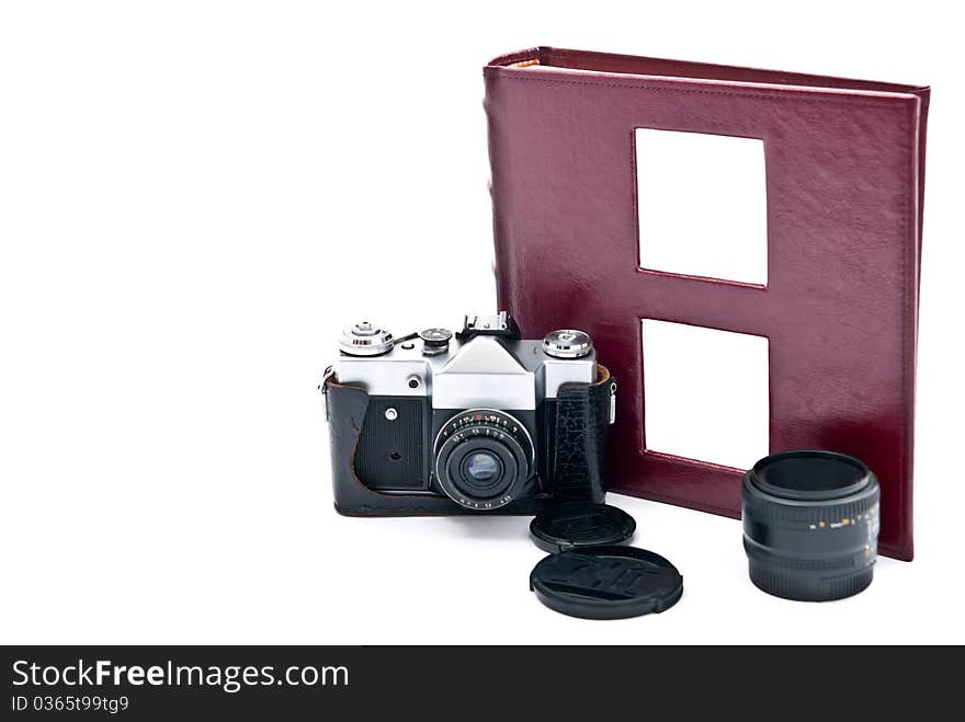 Vintage camera and red photo album. Isolated on white. Vintage camera and red photo album. Isolated on white