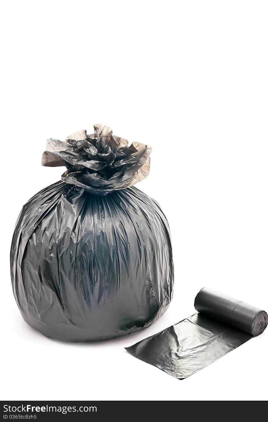 One black garbage bag isolated on white background. One black garbage bag isolated on white background