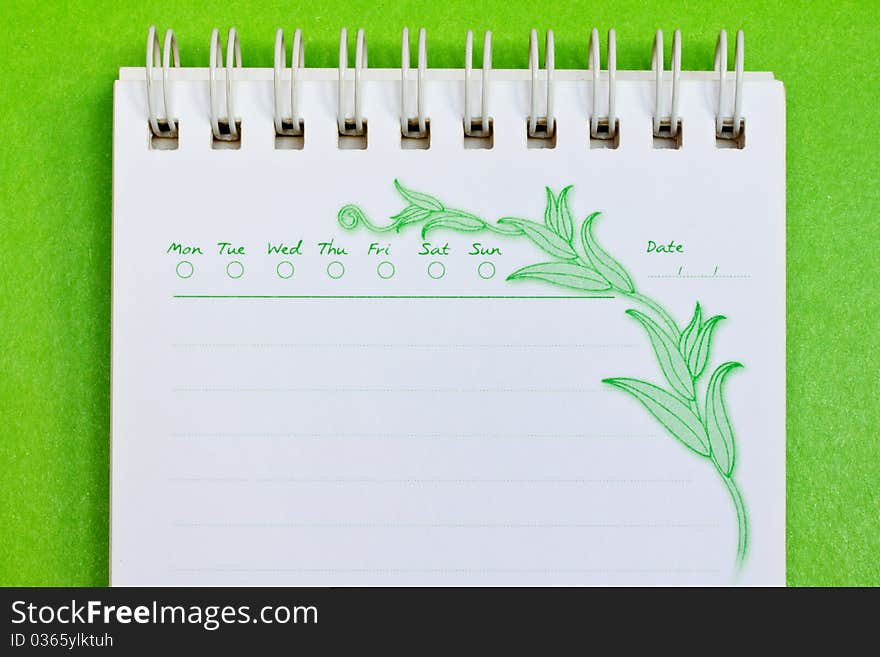 Close up of a note paper on green background with clipping path