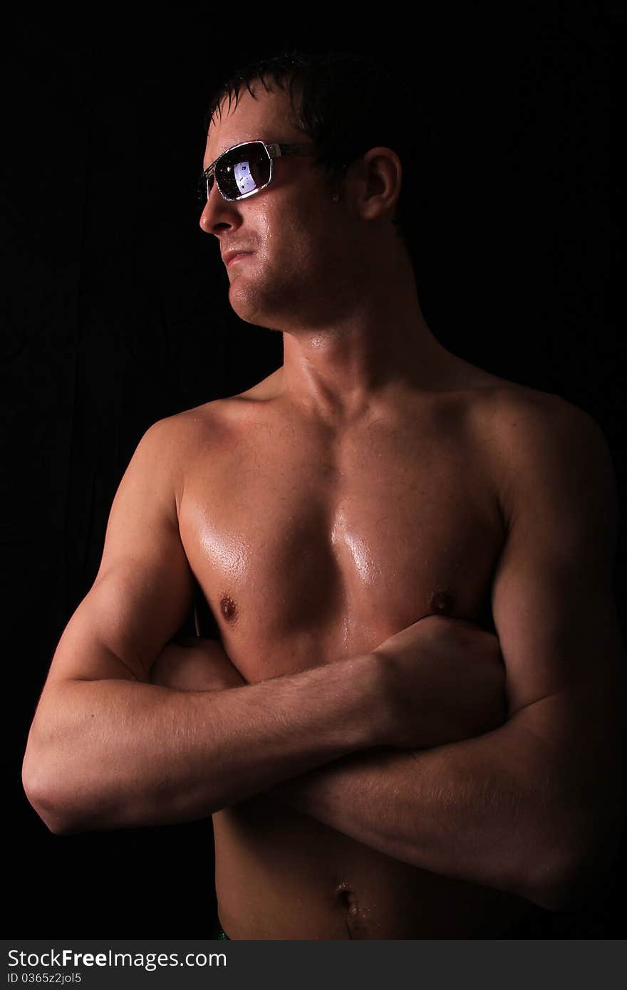 Male model with glasses on looking towards a light. Male model with glasses on looking towards a light