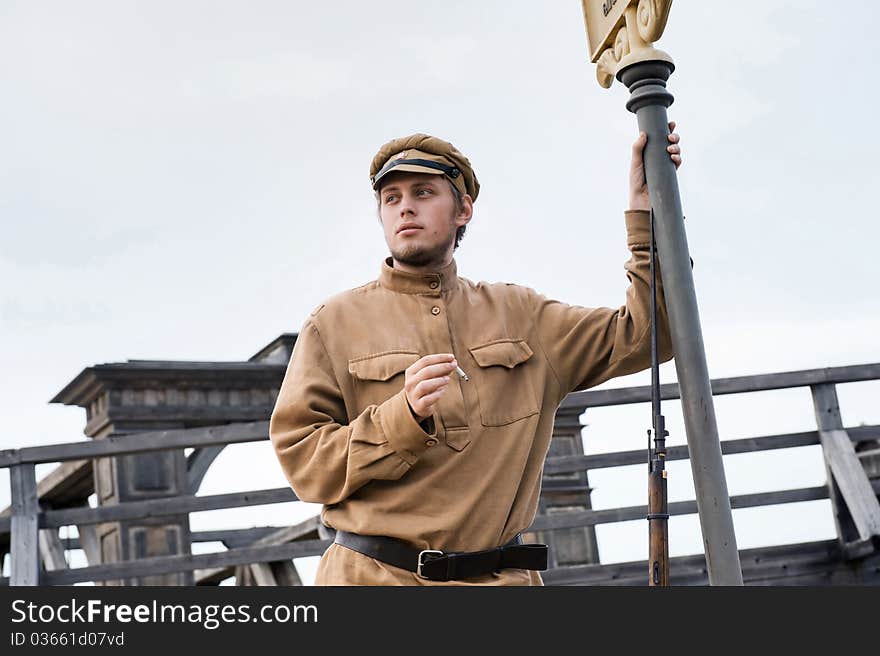 Retro style picture with smoking soldier.