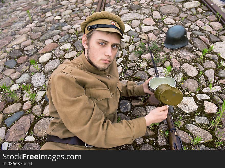 Soldier with boiler and gun in retro style picture