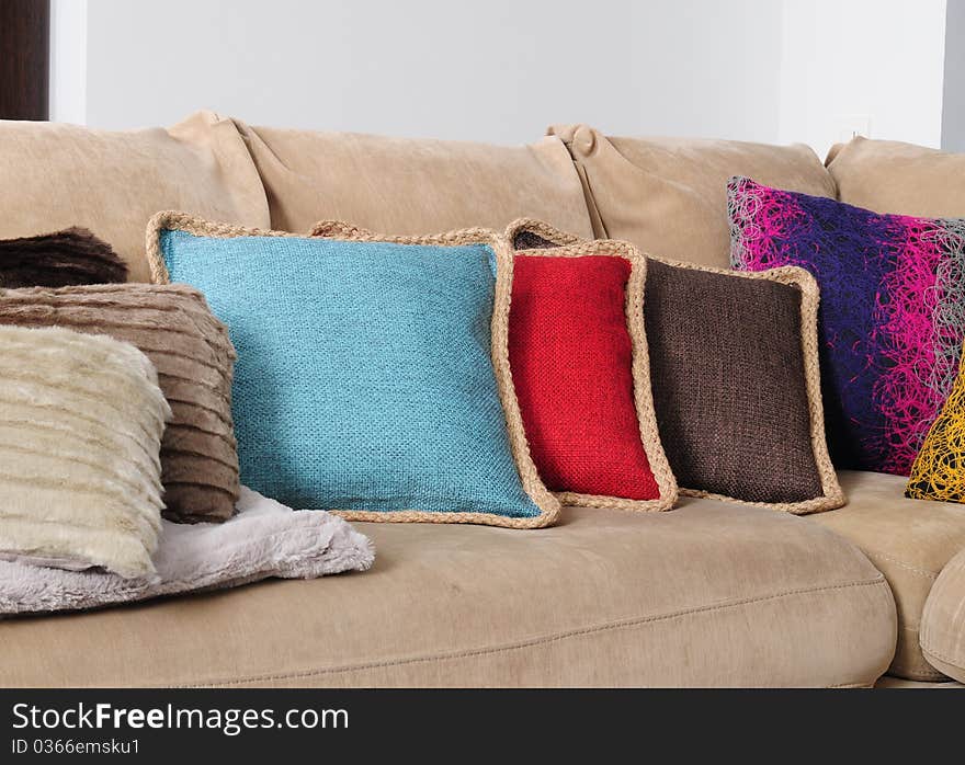 Cushions in a row on a sofa. Cushions in a row on a sofa.