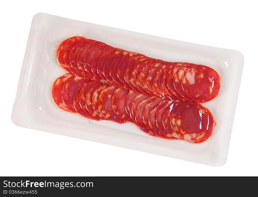 Slices of cured ham in a white tray for packaging. Slices of cured ham in a white tray for packaging.