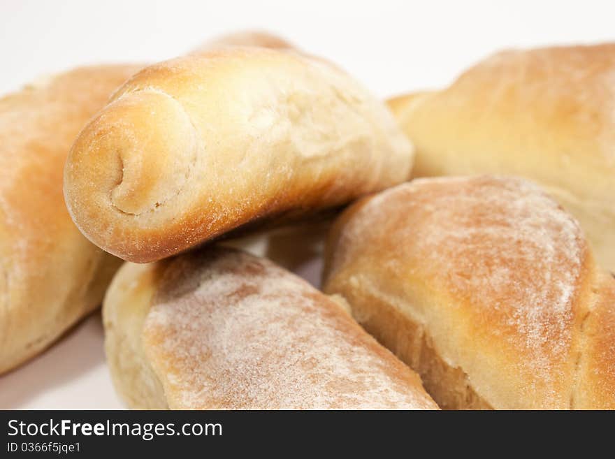 Yellow, beaked breads isolated on white background