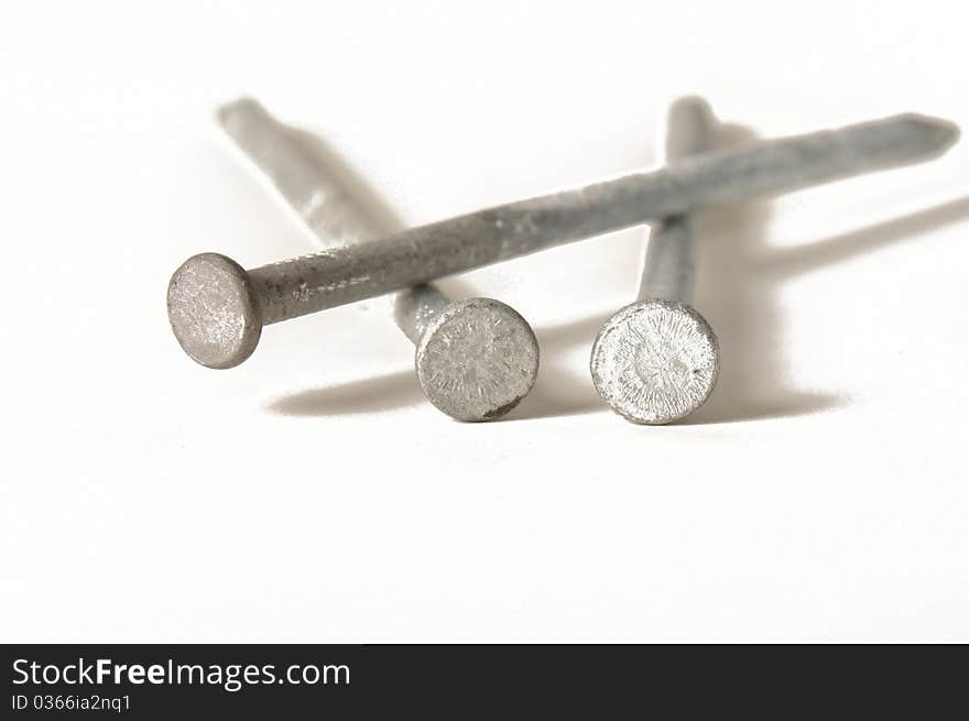 Three nails on a white background