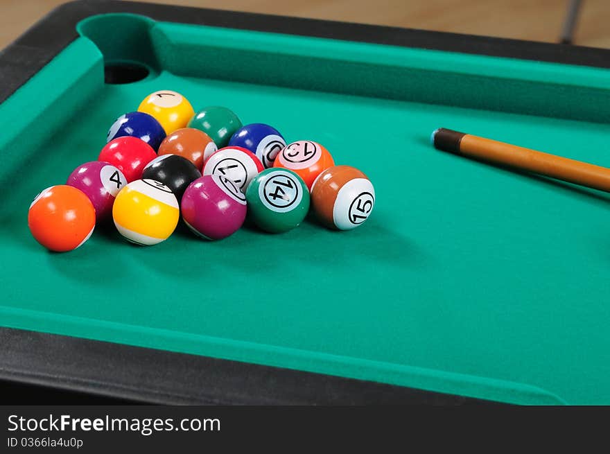 Green billiard table with arranged balls. Green billiard table with arranged balls.