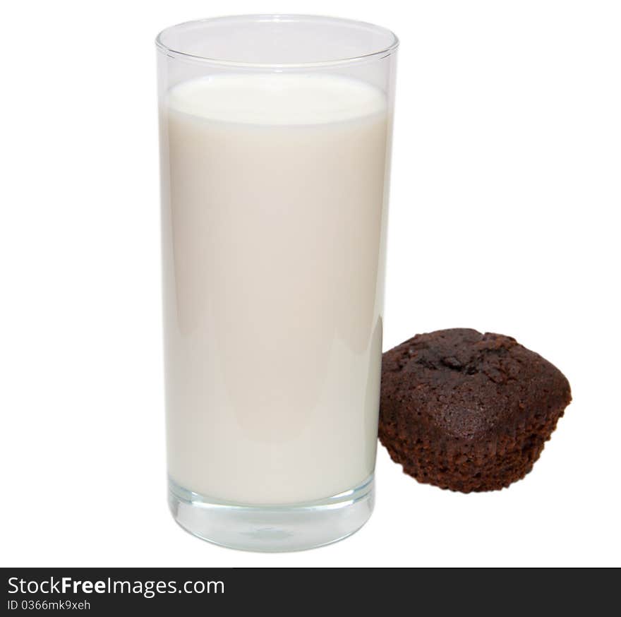 Glass of milk with brown sweet cake