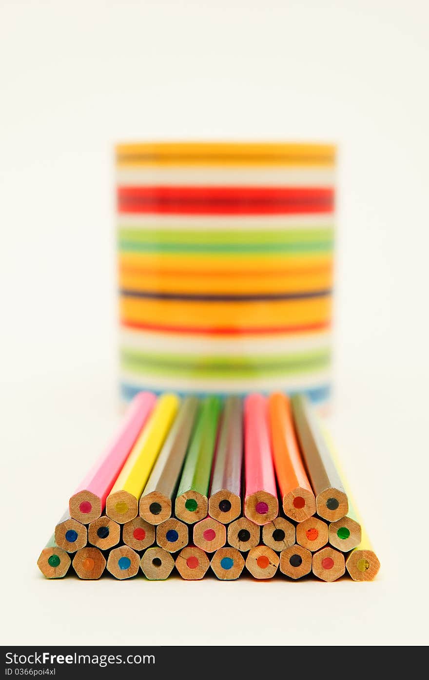 A stack of colored pencils on white background