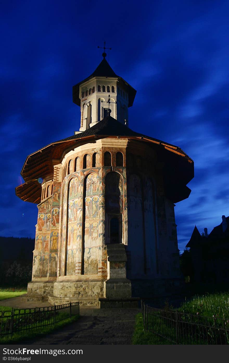 Moldovita monastery by night, on a blue sky