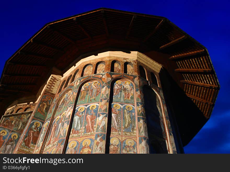 Moldovita monastery by night, on a blue sky