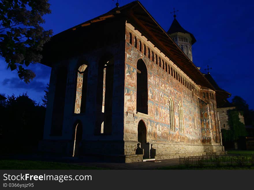 Moldovita monastery by night, on a blue sky