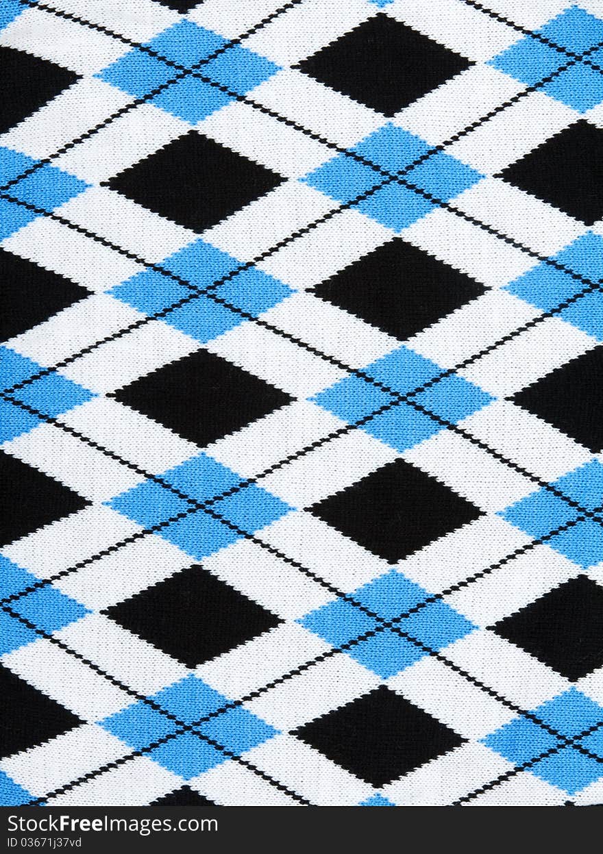 Background from knitted plaid fabrics with pattern