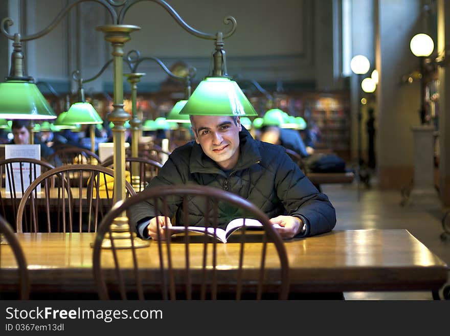 Middle age man reading at the Public Library in boston. Middle age man reading at the Public Library in boston