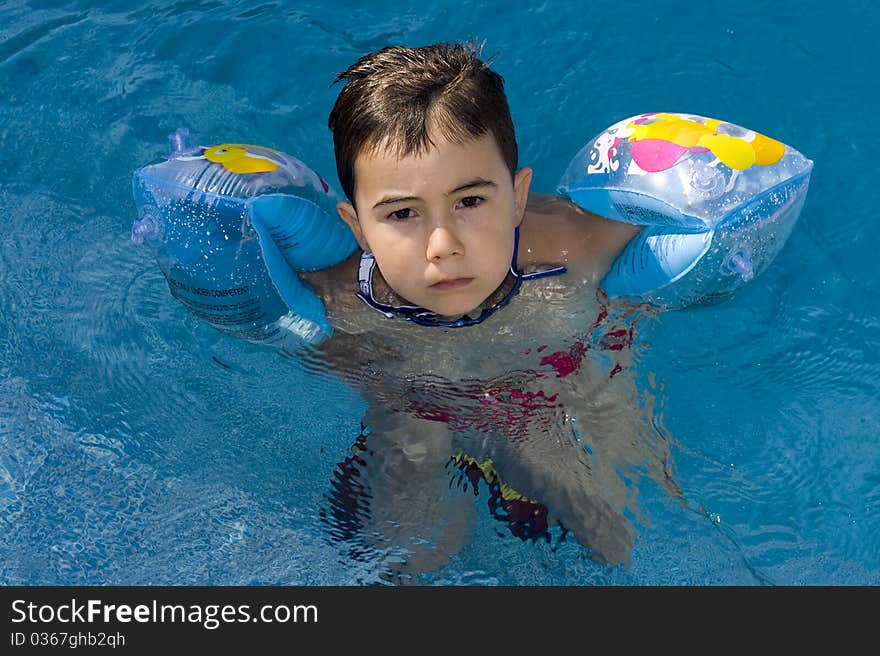 Little boy in the swimming pool