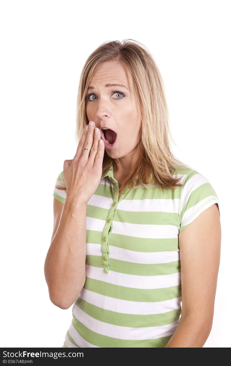 A woman in a green and white striped shirt making a face expression of being shocked. A woman in a green and white striped shirt making a face expression of being shocked.