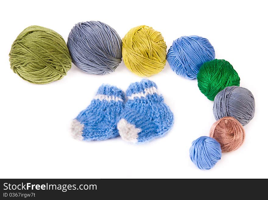 Chain of colorful clews and knitted socks