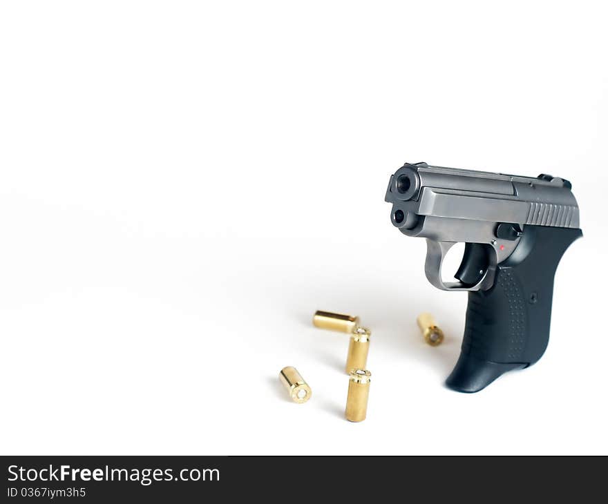 Five bullets and handgun with place for text. Five bullets and handgun with place for text