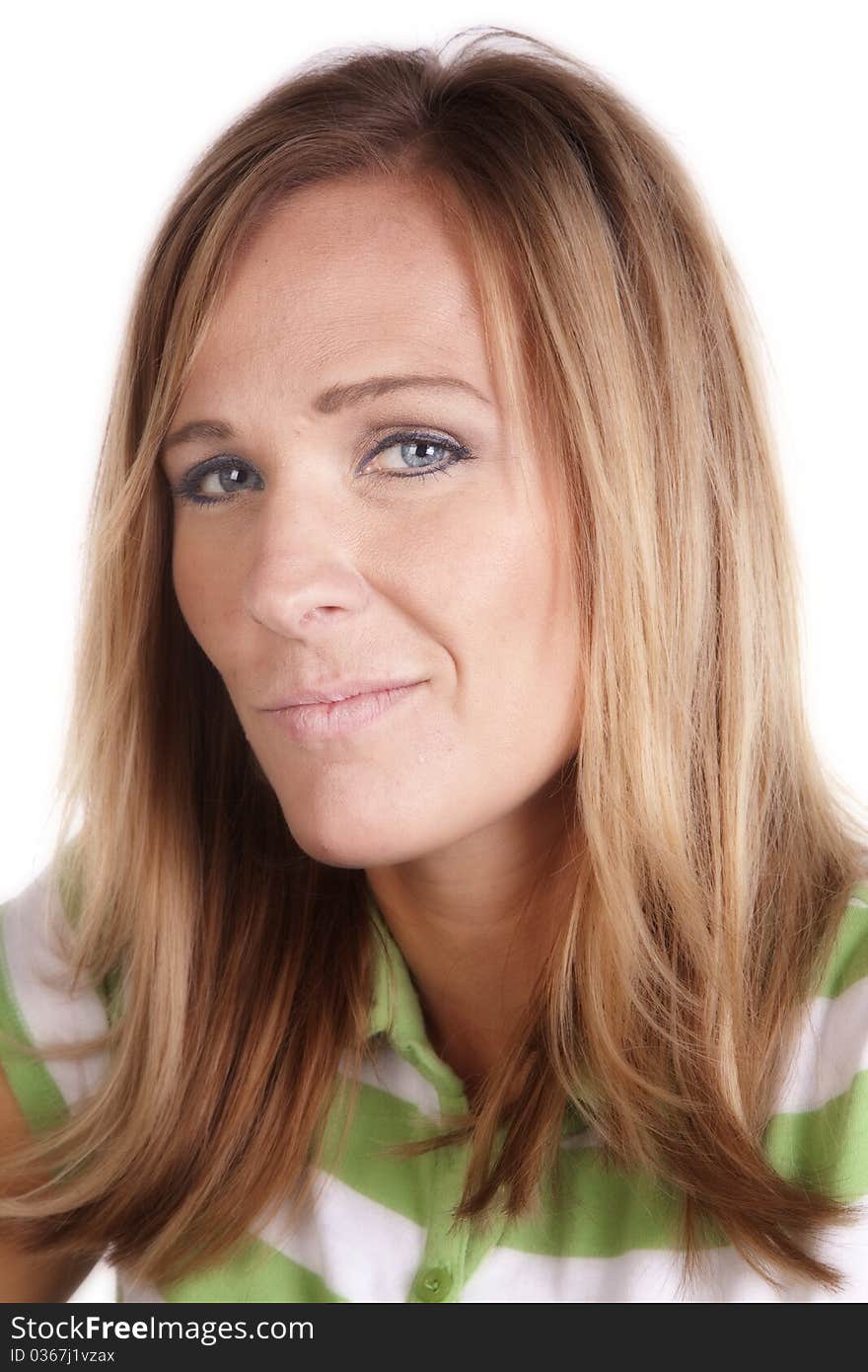 A woman in a green and white striped shirt smiling for a portrait. A woman in a green and white striped shirt smiling for a portrait.