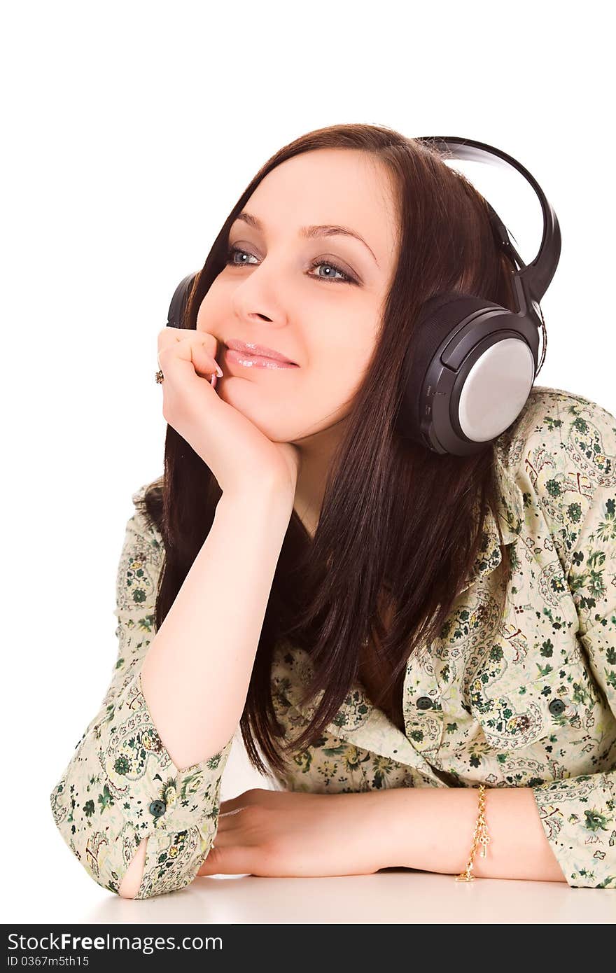 Photo of cute woman with headphones is listening to musc