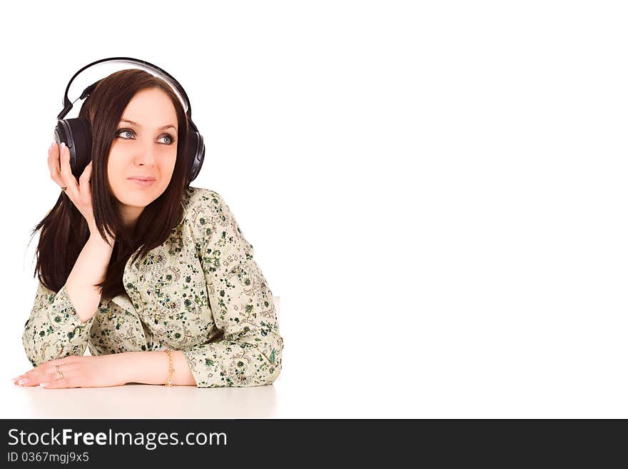 Photo of cute woman with headphones is listening to musc