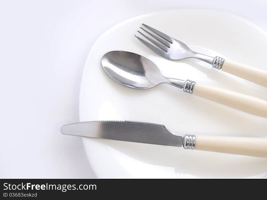 Fork, spoon and knife