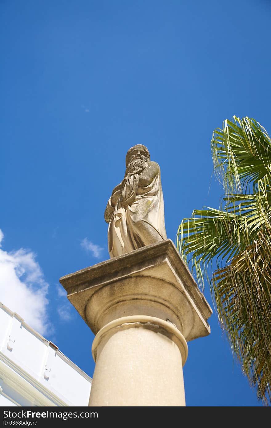 ancient statue over column