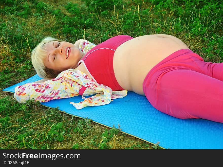 Young happy pregnant woman in outdoor. Young happy pregnant woman in outdoor