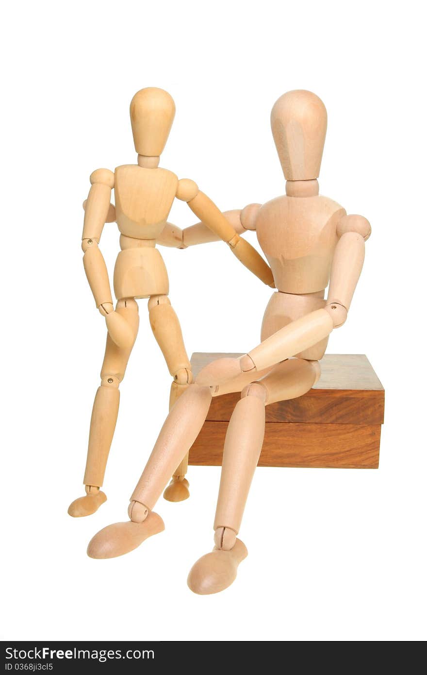 Two artist's manikins posing isolated against white