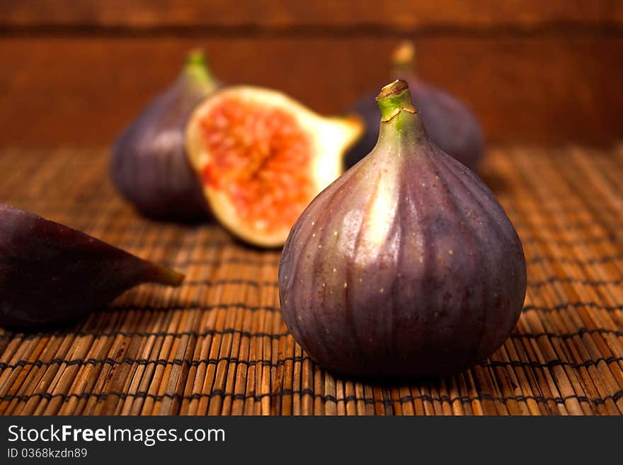 Ripe figs on rural background