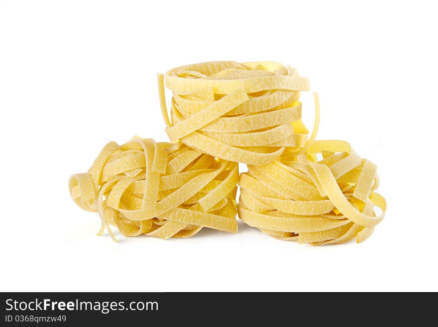 Vermicelli pasta nests on white