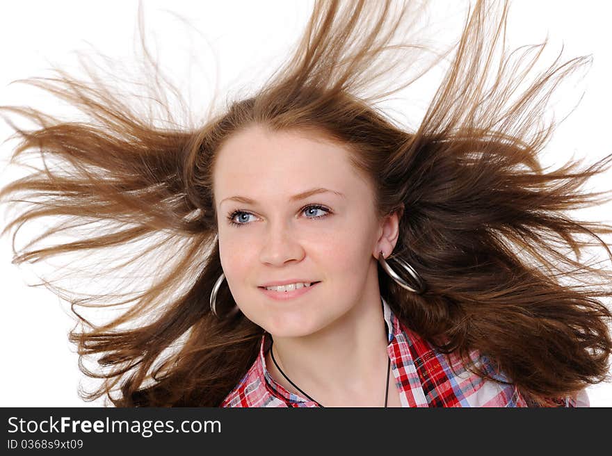 Girl with hair fluttering in the wind. On a white background