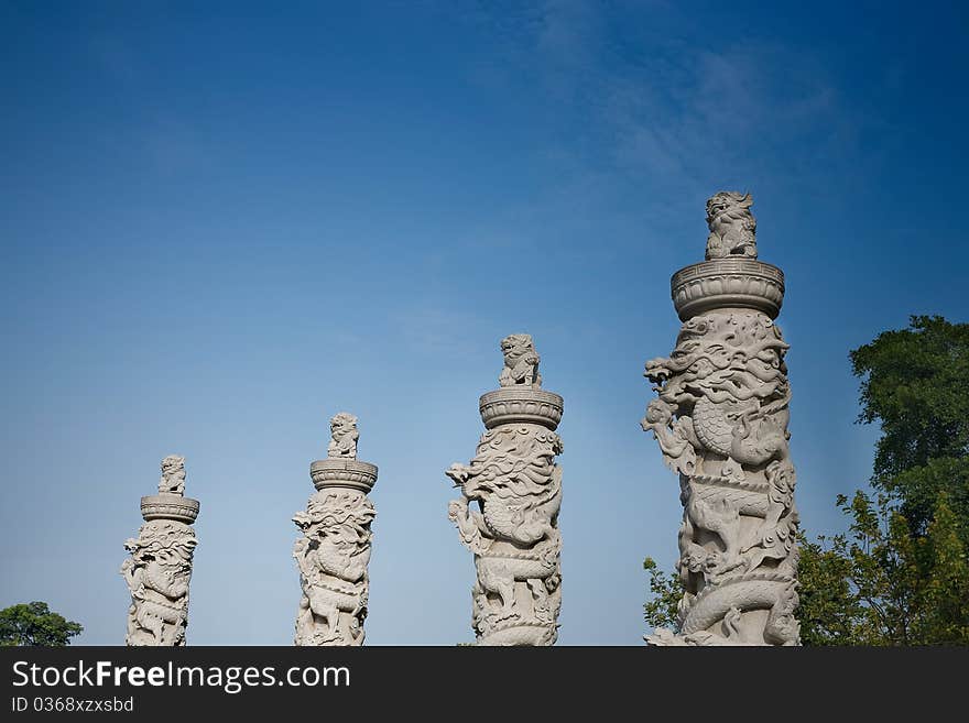 Totem pole with lion and dragon,China. Totem pole with lion and dragon,China.