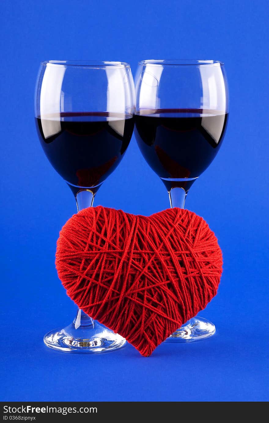 Two glasses of wine and a red heart