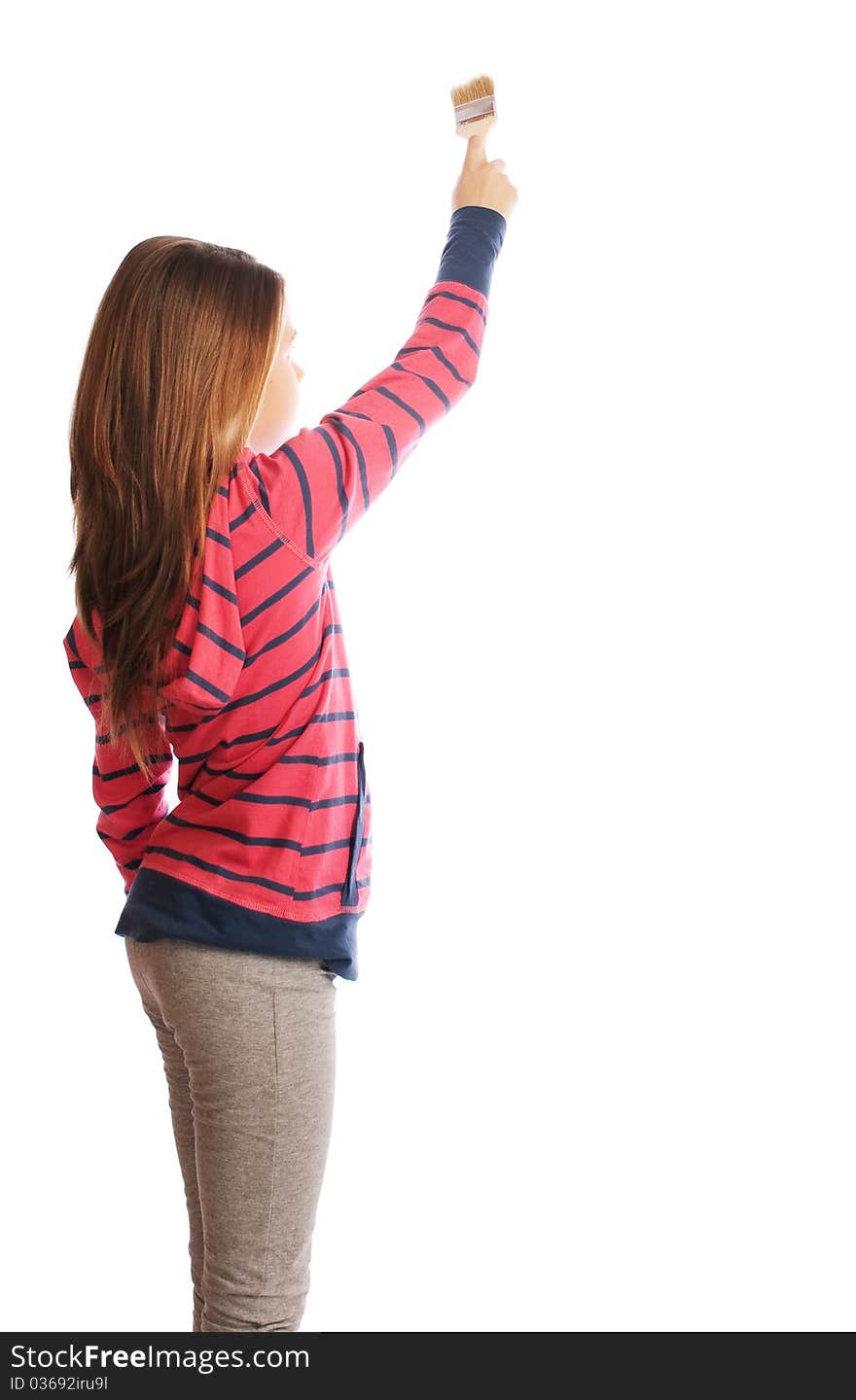 Girl on a white background with a brush in his hand. Girl on a white background with a brush in his hand