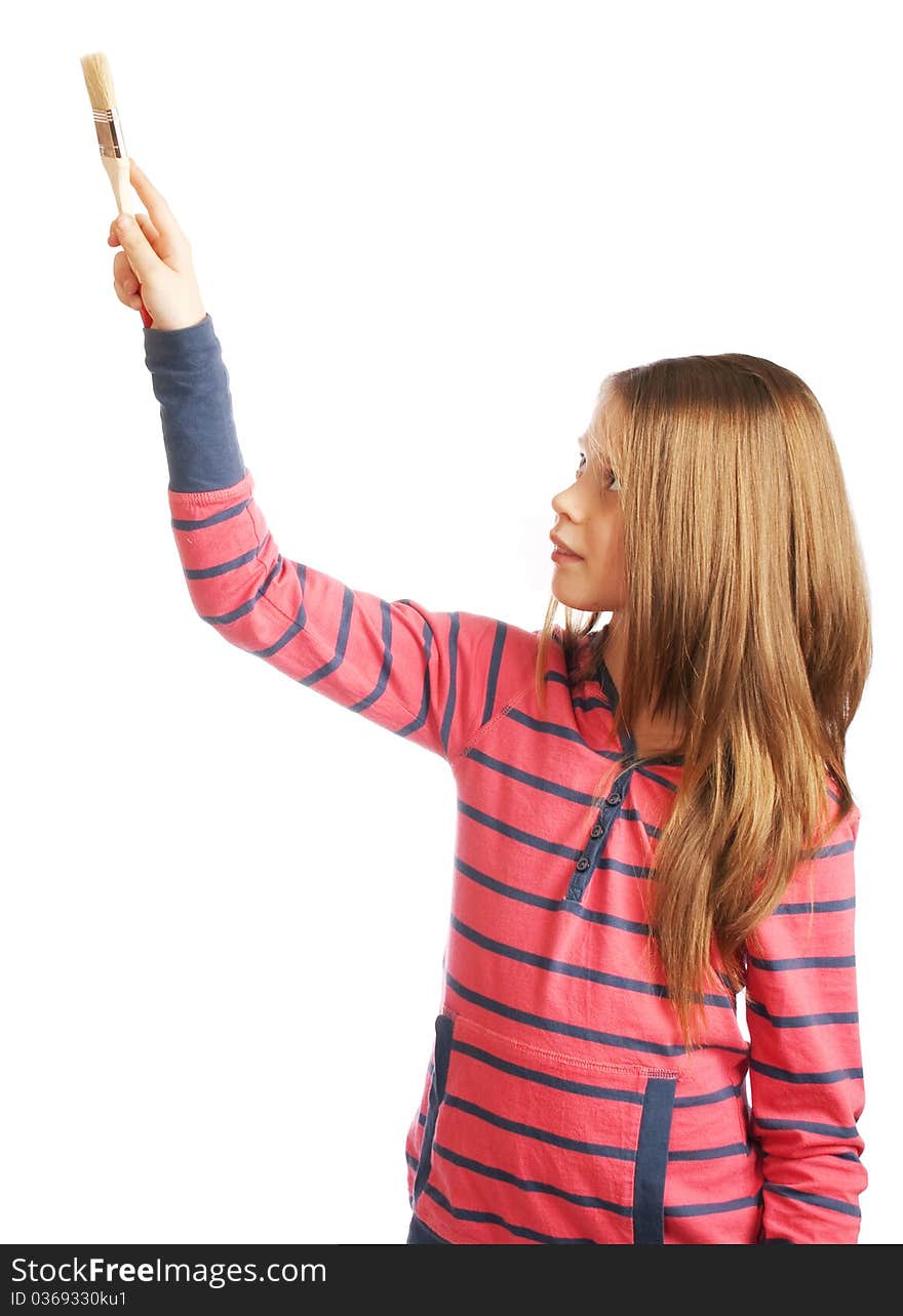 Girl with a paintbrush in his hand on a white background