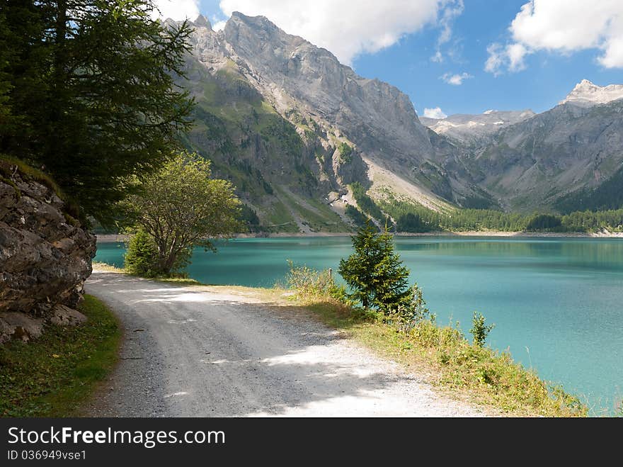 Road on the shores of Lac de Tseuzier in Switzerland