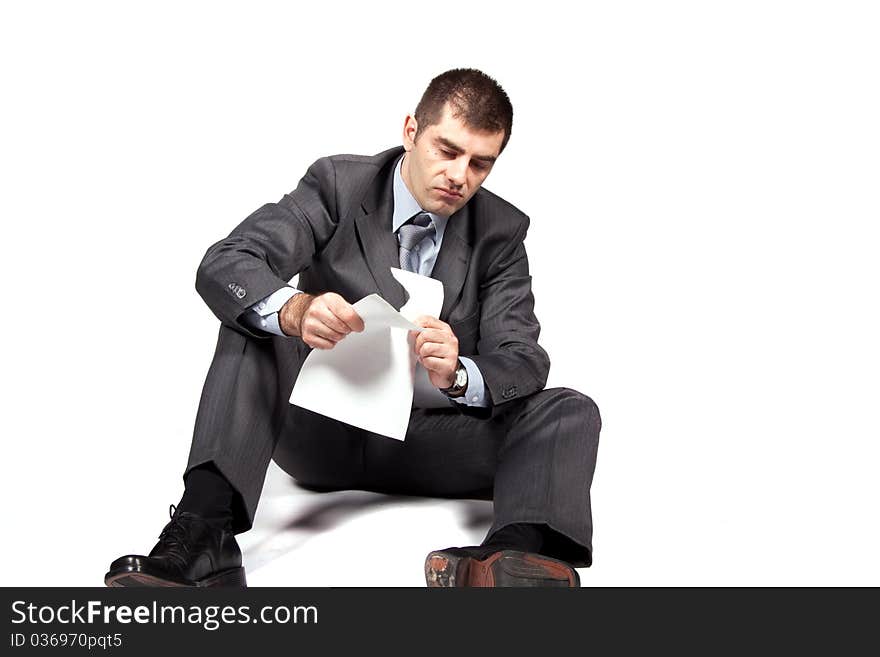 Worried businessman against white background