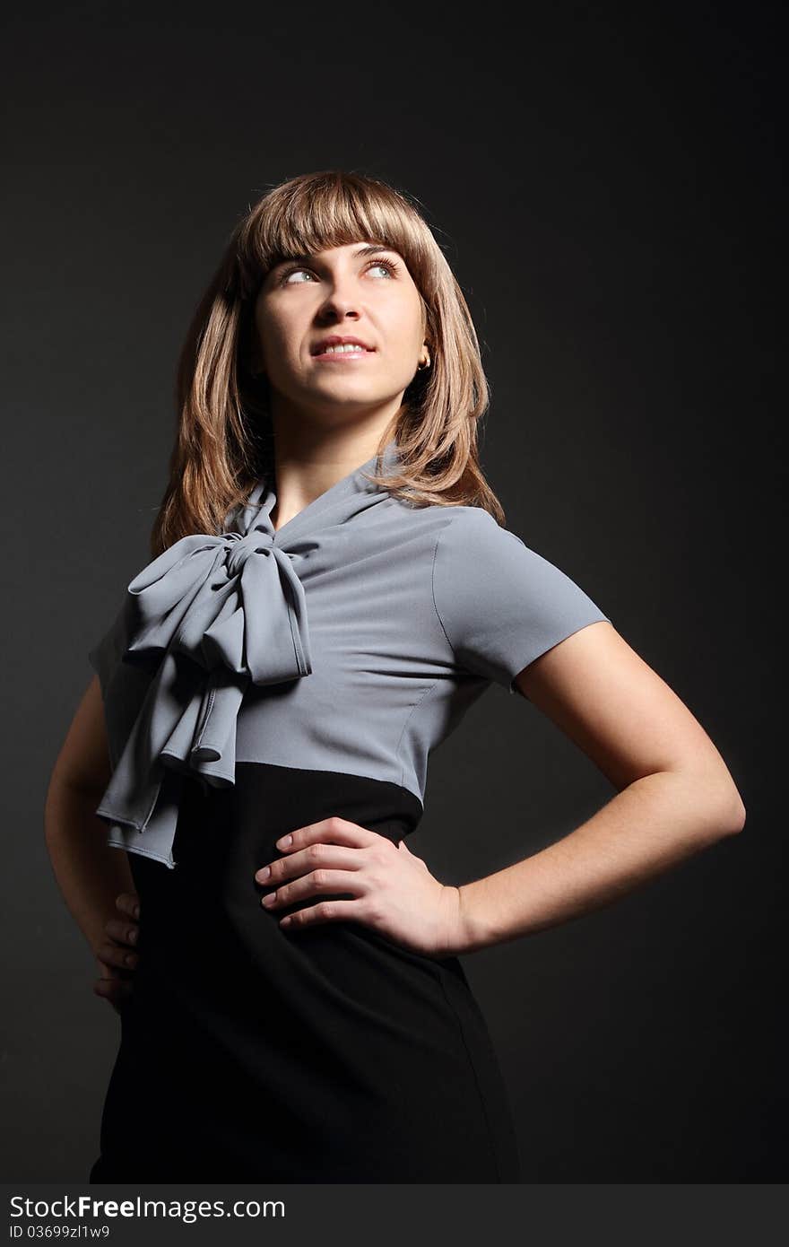 Young business woman in grey and black dress