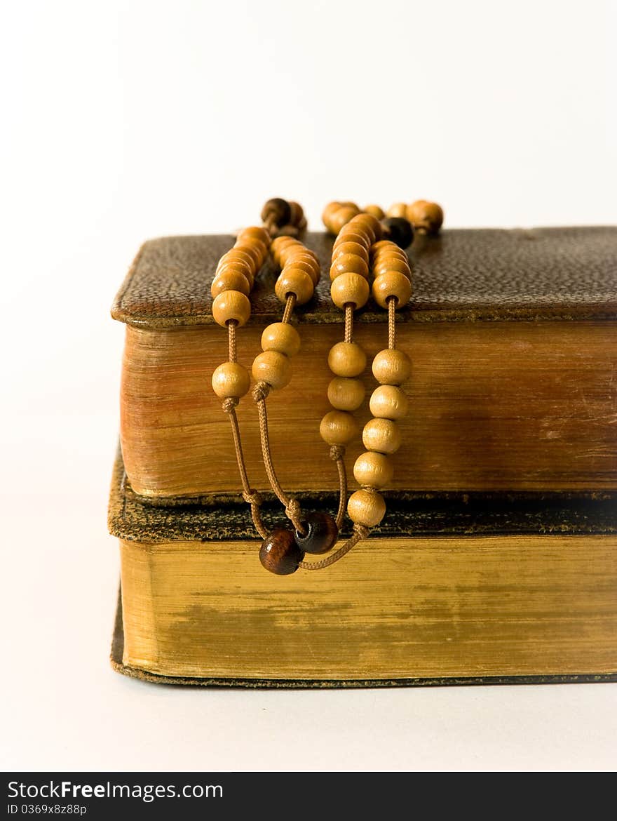 The book of Catholic Church liturgy and rosary beads. The book of Catholic Church liturgy and rosary beads