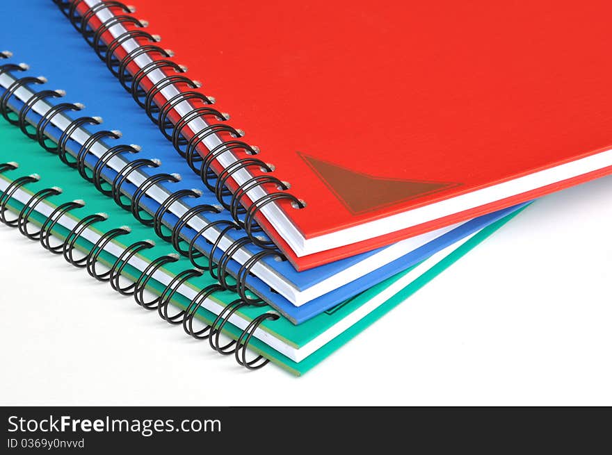 Corner Of Three Color Rectangular Notebooks