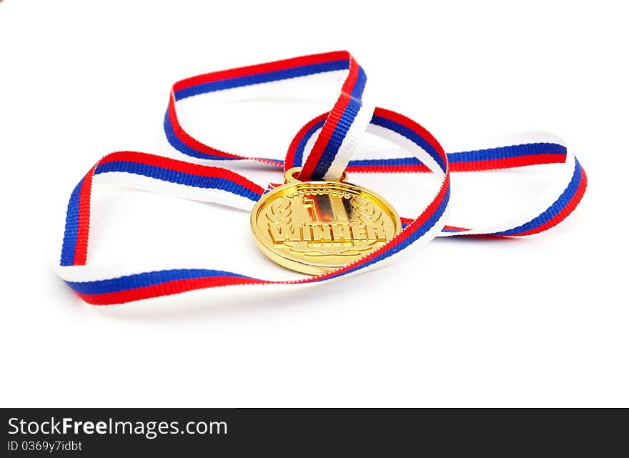 Golden medal and ribbon isolated on white background