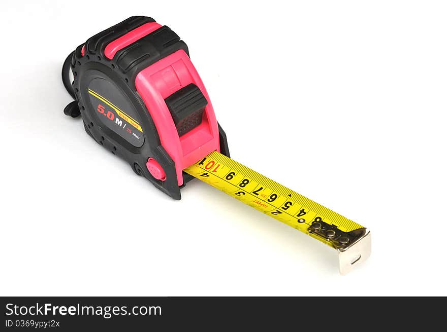 Pink steel tape measure on white background.