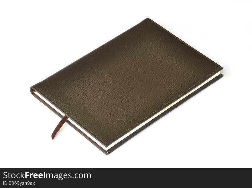 Dark brown leather notebook on white background.