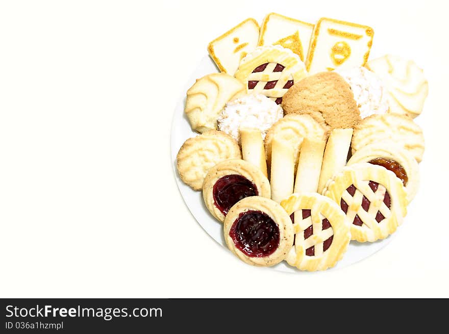 Cookies on a plate with jam on a white background