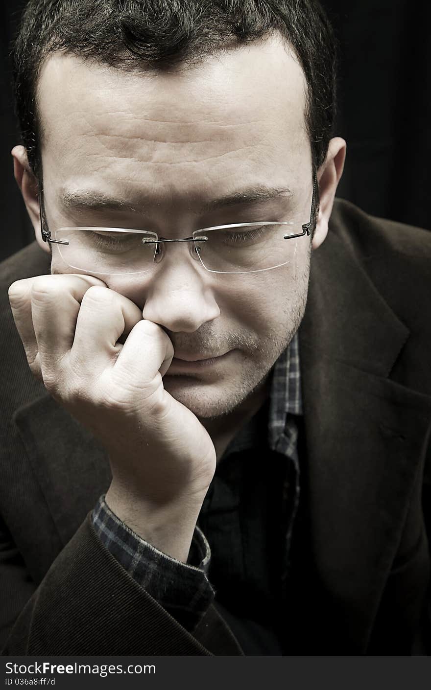 Portrait of a man, isolated over black background. Portrait of a man, isolated over black background