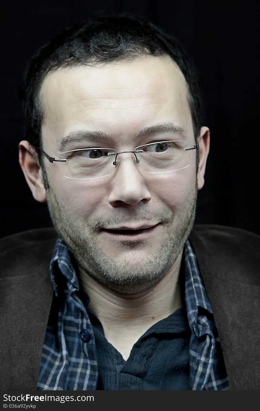 Portrait of a man, isolated over black background. Portrait of a man, isolated over black background