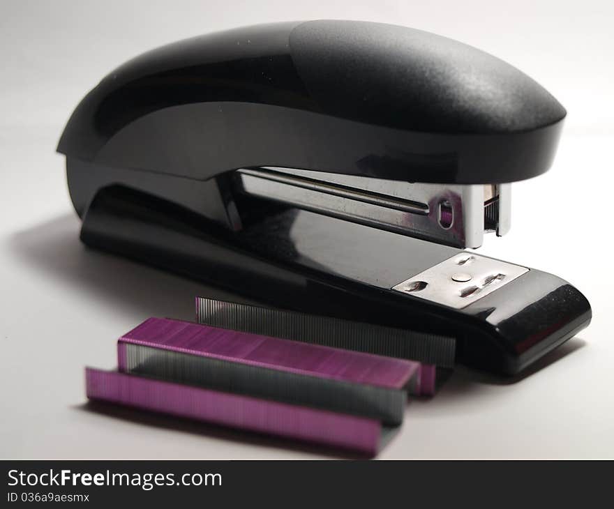 Black Stapler and Staples isolated on a white back ground